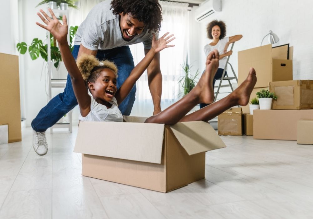 Family with moving boxes